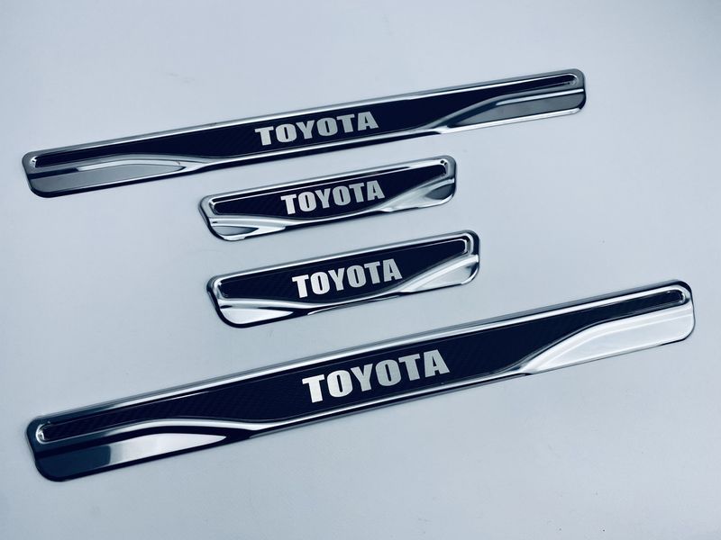 Накладки на пороги Toyota Land Cruiser 100 1996-2003 (хром-карбон) TAN24 00-00011780/34 фото
